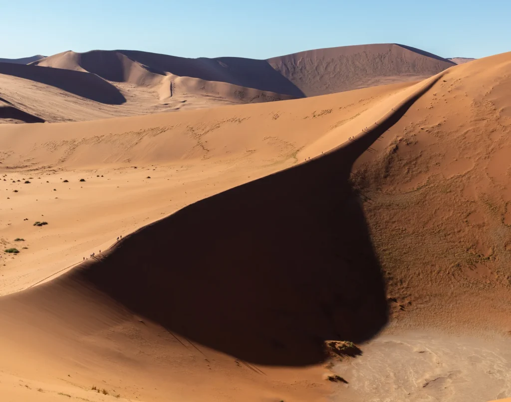 A dark shadow boundary across a dune in the Sossusvlei area